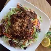 Grill Pork Salad (gỏi thịt Nướng) · Red and green cabbage, spring mix, carrots and daikon, shallots, peanuts and homemade dressi...