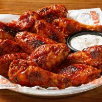 Hooters Daytona Beach Style Wings · Naked wings tossed in our signature Daytona Beach sauce. After they're done, we throw them o...