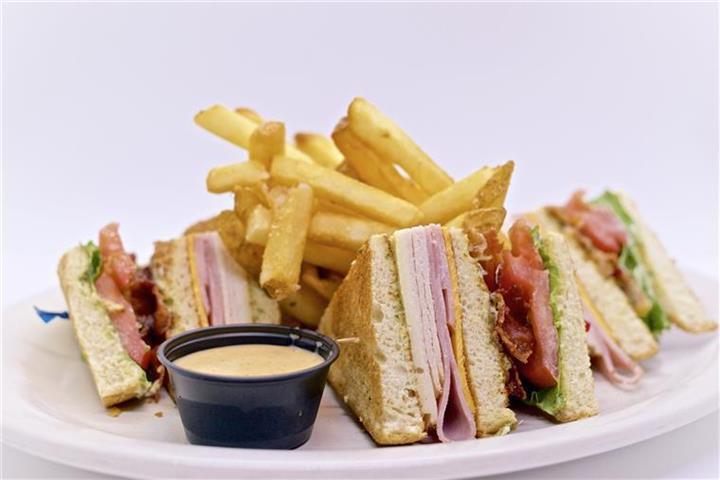 Classic Club Sandwich · Fresh turkey, ham, Swiss and American cheeses, applewood smoked bacon, lettuce, tomato, basil mayo served triple-Decker with honey Dijon dipping sauce.