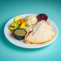 Roast Turkey Dinner · Herb stuffing, mashed potatoes, mixed vegetables, homemade cranberry sauce and gravy.