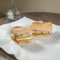 Smoked Turkey and Avocado Sandwich · Prepared and flavored with smoke. 