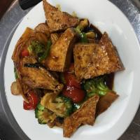 T5. Home-Style Tofu · Fried tofu with broccoli, snow peas, baby corn, red bell peppers, bamboo shoots and fresh mu...