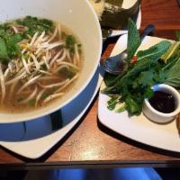 Beef Vietnamese Noodle Soup · Hanoi-style spiced broth, sliced tenderloin, thin rice noodles and fresh herbs.