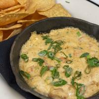 Shrimp ＆ Crab Dip · shrimp, jumbo lump crab, cream cheese, with old bay
and corn tortilla chips, topped with gre...