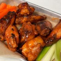 Wings · jumbo chicken wings, tossed in bbq, buffalo, or alabama white bbq sauce