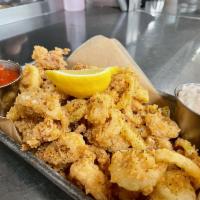 Garlic Pepper Calamari · tender calamari and italian cherry peppers,
flash fried and tossed in garlic butter,
with ho...