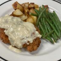 Chicken Fried Chicken · buttermilk breaded and seasoned with our chicken
shake, with garlic roasted potatoes, steame...