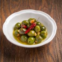 Warm Marinated Olives · Stuffed with Marcona Almonds