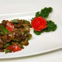 60. Pepper Steak with Onion · Stir fried steak with vegetables and a savory sauce.