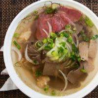 Raw Beef, Brisket, Tendon, Tripe, Fatty Flank and Meatball Pho · Vietnamese noodle soup.