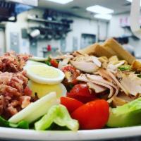 Cobb Salad · Smoked turkey breast, bleu cheese crumbles, bacon, tomato, and croutons, and avocado. Served...