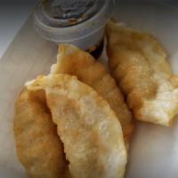 Gyoza Dumplings · 4 pieces. Served with soy based sauce.