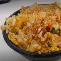 Chicken Fried Rice · Fried rice with chicken, carrots, corn, peas, lima beans, and green onions. Bowl served over...