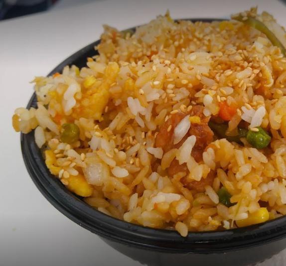Chicken Fried Rice · Fried rice with chicken, carrots, corn, peas, lima beans, and green onions. Bowl served over rice.