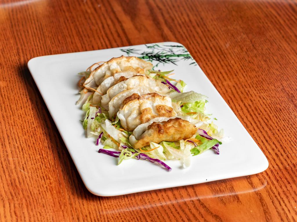 Potstickers · 6 pieces. Pan-seared or lightly steamed chicken and vegetable dumplings served with Chinese ginger soy sauce.