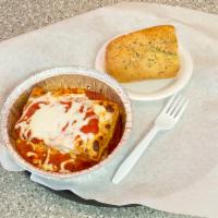 P3. Lasagna · 4-layer lasagna with ground beef, ricotta and other cheeses, topped with mozzarella and serv...