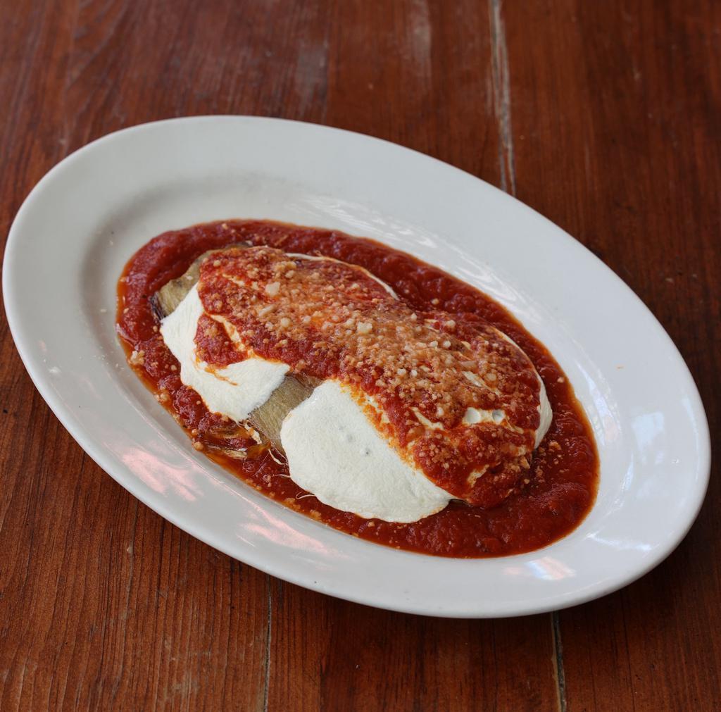 Eggplant Parm · Thick slice of eggplant, roasted and topped with tomato sauce, mozzarella and grana. Gluten free.