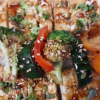 Tofu Plate · Grilled Tofu glazed Teriyaki sauce on rice bed. comes with grilled veggie, pickeled veggie a...