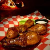 Chicken Wings · Cooked wing of a chicken coated in sauce or seasoning. 