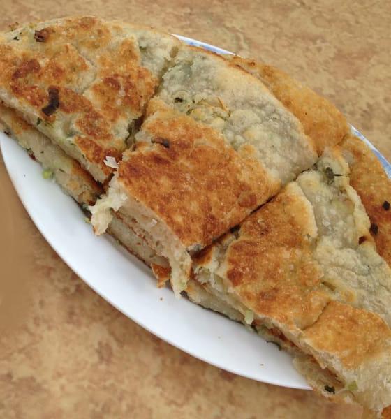 203. Scallion Pancake · 1 piece. Savory folded flatbread. 