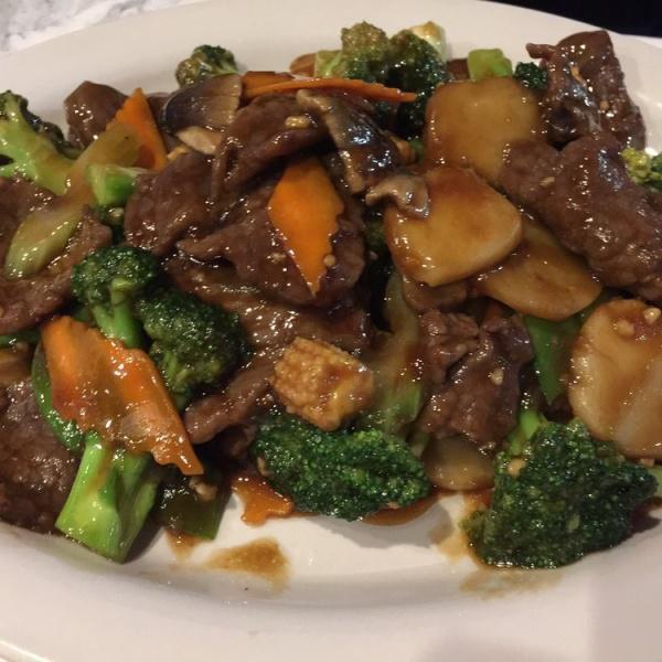 Beef with Broccoli · Sliced beef stir-cooked with broccoli and carrots in chef's brown sauce. Served with steamed white or brown rice.