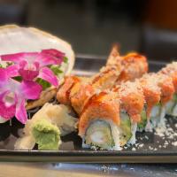 S26. Christmas Roll · Shrimp tempura cucumber and avocado topped with spicy tuna and tempura flakes.