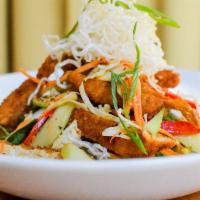 Beyond Asian Salad · Spinach, cabbage, carrots, cucumber, green onion, crispy rice noodles, Beyond Chicken Tender...