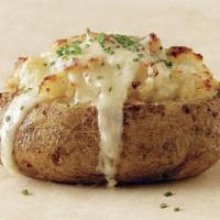 Baked Potato · Topped with sour cream. 