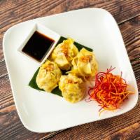 Homemade Momo · Fried or steamed dumplings, mashed chicken and shrimp seasoned in soy sauce, Japanese shiita...