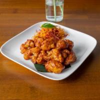 Lasooni Gobi · Fried cauliflower satay tossed in our house made Indian-style barbecue sauce with spring oni...