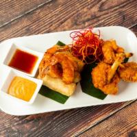 Chingri Appetizer Combo · A sampler of our most popular appetizers: fried
thai chicken wings, shrimp tempura, and
spri...