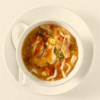 Hot and Sour · Mushroom, bamboo shoots, carrot, tofu, and eggs in a savory vinaigrette seasoned broth, and ...