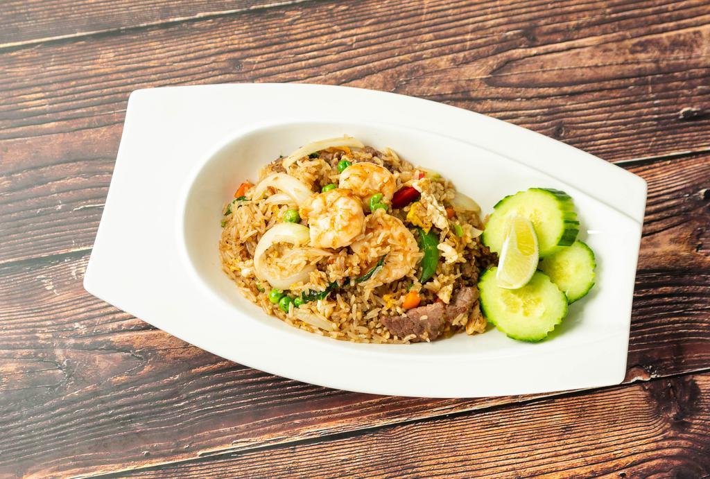 Chingri Special Fried Rice · Thai-style fried jasmine rice with beef, chicken, shrimp, egg, fresh garlic, basil, green peas, carrots, bell pepper and scallions.