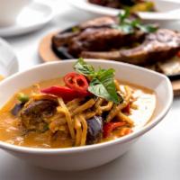 Red Curry · Coconut milk, bamboo shoots, eggplant, green and red bell peppers and Thai basil in a colorf...