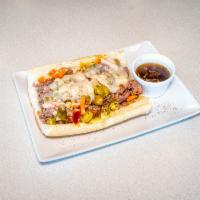 Cheezy Italian Beef Sandwich · Served With Hot or Sweet Preppers. Also, choose to have the bread dipped in gravy. 