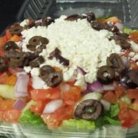 Greek Salad · Romaine lettuce, tomato, Kalamata olives, feta cheese, cucumber and red onions.