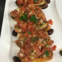Bruschetta Dinner · Toasted garlic bread topped with fresh chopped tomatoes, onions and herbs.
