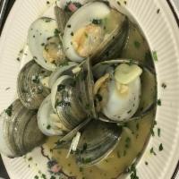 Zuppa Di Clams Dinner · Littleneck clams sauteed with scallions, onions, and garlic in a white wine sauce with a tou...