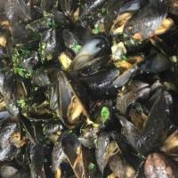 Zuppa Di Mussels Dinner · Mussels sauteed with scallions, onions, and garlic in a white wine sauce with a touch of tom...
