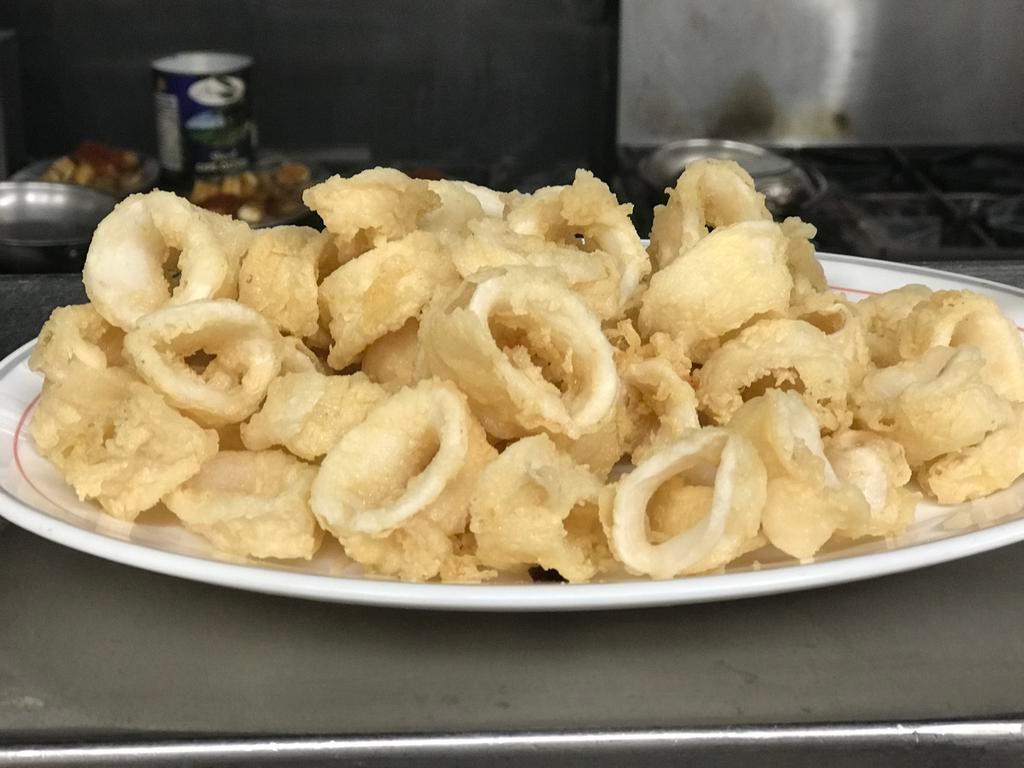 Fried Calamari Dinner · Tender rings of squid, breaded and fried to perfection.