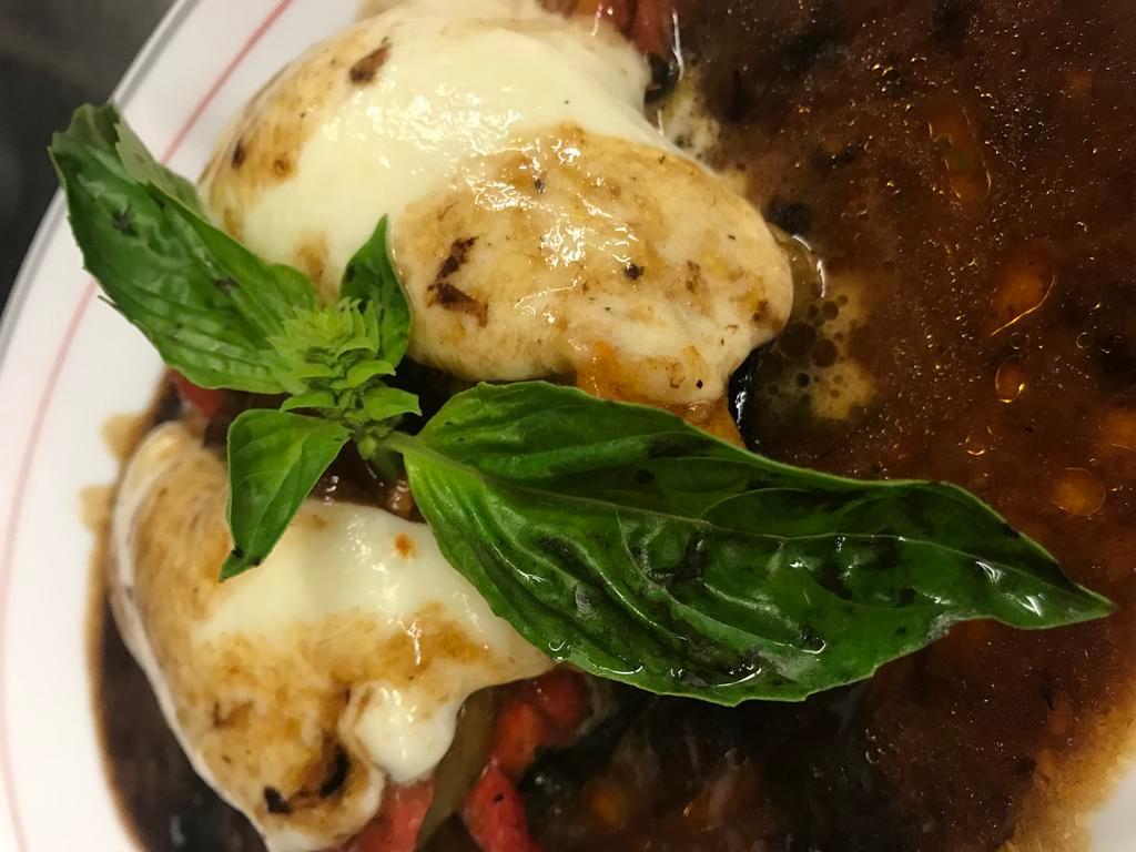 Grilled Portobello Mushrooms Dinner · Topped with roasted peppers and fresh melted mozzarella cheese in a balsamic vinaigrette.