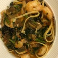 Linguine Mare e Monti Dinner · Linguini with shrimp, broccoli rapa and wild mushrooms in a light tomato sauce.