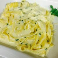 Fettuccine Alfredo Dinner · Served with cream sauce and cheese.