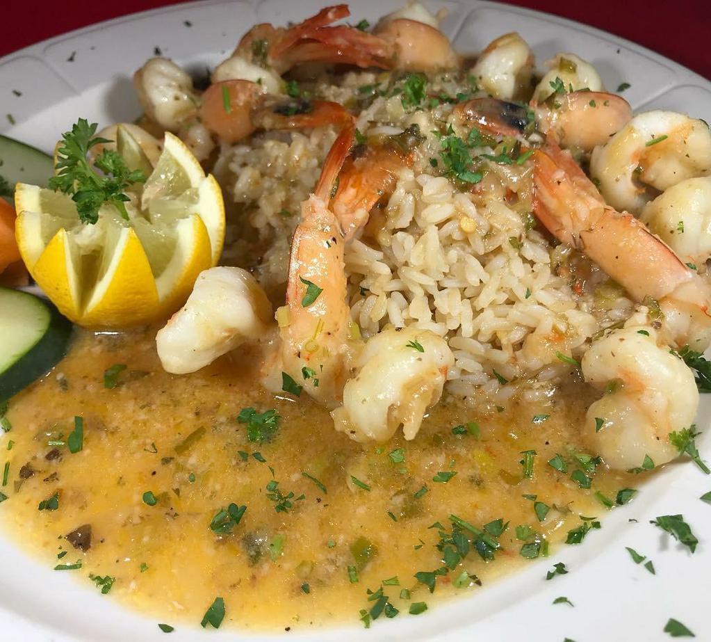 Gamberi Scampi Dinner · Jumbo shrimp sauteed in an olive oil, garlic and butter sauce, served over a bed of rice.