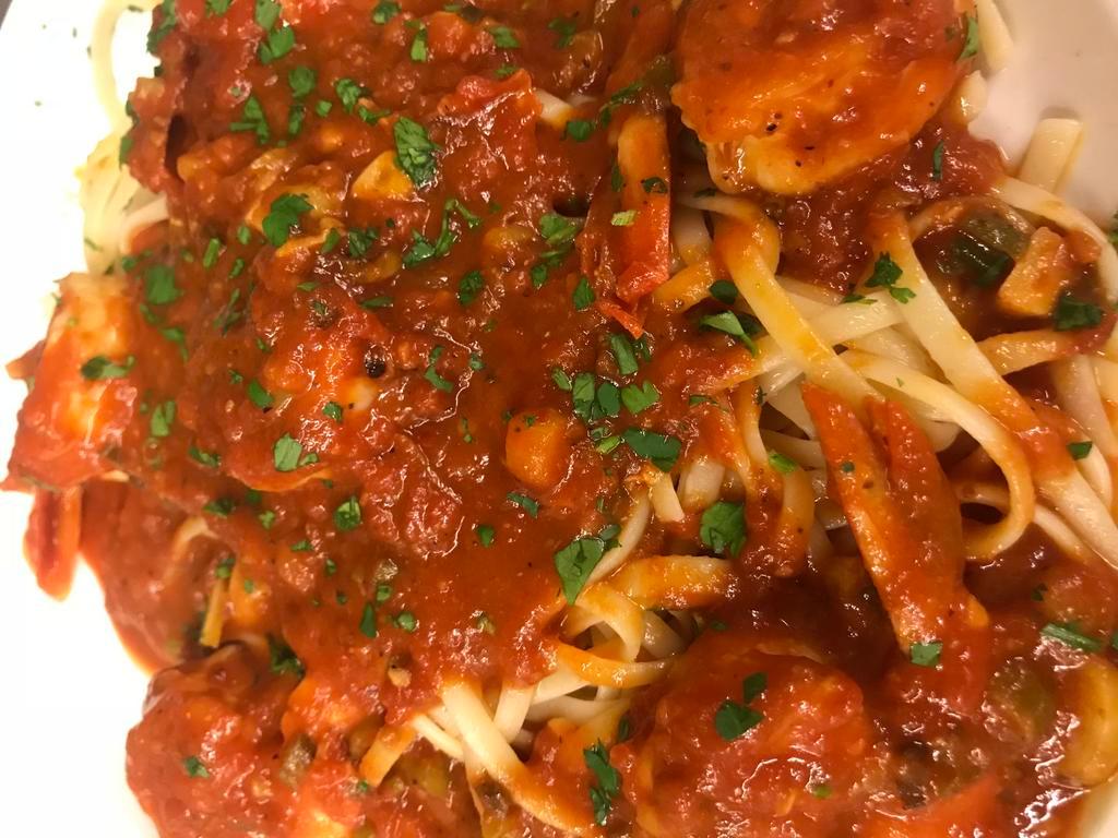 Gamberi Marinara Dinner · Jumbo shrimp with tomato sauce, sweet, and served over a bed of linguine.