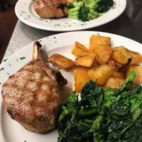 Costata di Maiale ai Ferri Dinner · Broiled pork chop served with mixed vegetables.