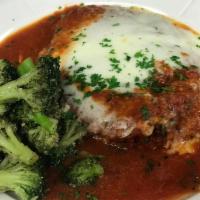 Vitello Parmigiana Dinner · Veal scalloppine sauteed and topped with tomato sauce and melted mozzarella cheese.