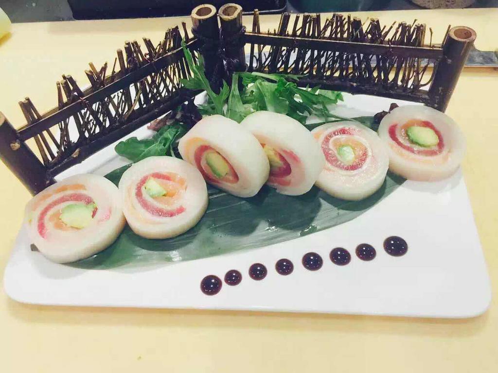 Naruto Roll · In: Tuna, salmon, hamachi, and avocado. Out: Cucumber wrap. No rice.