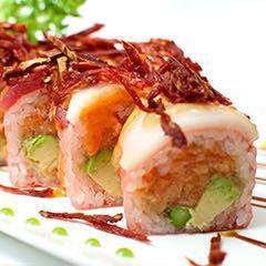 American Dream Roll ·  SOY PAPER  . In: Shrimp tempura, spicy crab meat and avocado. Out: Assorted raw fish, deep fried onion. 