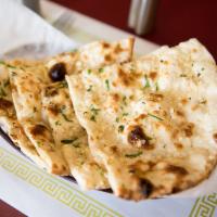 Garlic Naan · Flat white bread baked in a clay oven sprinkled with garlic and cilantro.